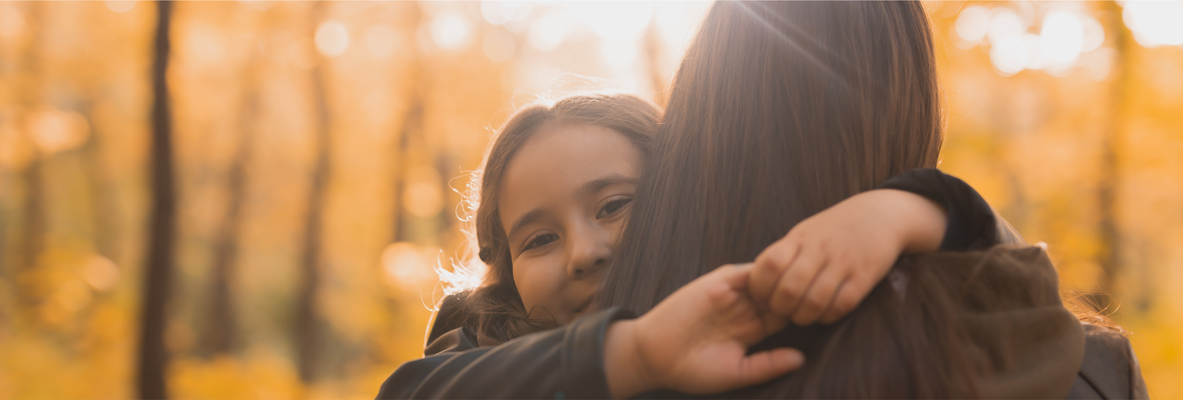 Mother and daughter spend time together in autumn yellow park Season and single parent concept